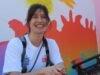 Mural artists creating downtown city wonderwalls