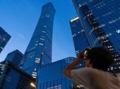 Small aircraft hits tallest Beijing building: witnesses