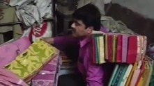 TMC leader hides under pile of sarees to dodge arrest, police find him