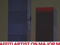 Graffiti artist in standoff with police on major bridge