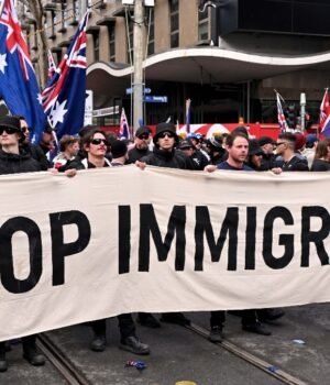 protesters-hold-a-banner-during-a-march-for-australia-anti-immigration-rally-in-melbourne-on-augus-082517980-16x9_0.jpg
