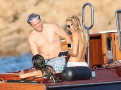 Model Brooks Nader ditches bikini top while on boat with parents in Italy