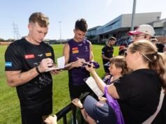 Purple pride on show as Fremantle Dockers’ men’s side get around club’s women’s side ahead of big September