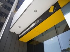 Big bank books huge profit, warns economy is slowing