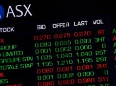 Aussie shares advance as mining stocks hit record highs