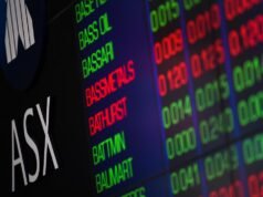 Aussie shares edge higher as iron ore tumbles