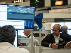 Wall Street closes lower as US bond yields rise