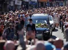 Crowd sings Bonnie Tyler hit as coffin returns home
