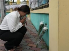 Thai families retrieve bodies after school shooting