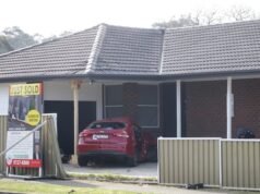 Two fighting for life after police car crashes into side of house after wild pursuit through Bossley Park