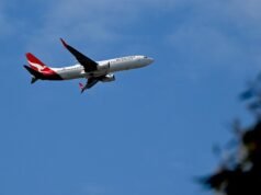 Smoke from tug vehicle forces evacuation of Qantas flight at Sydney Airport