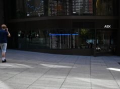 Aussie shares sink back into red as bond yields spike