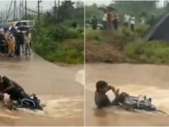 Rajasthan man tries to cross flooded road on bike, gets almost swept away