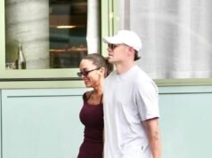 Lachie Neale loved up with girlfriend Emma Field as he awaits final decision on the appeal of his suspension