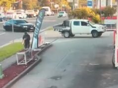 Wild moment car smashes through Sydney petrol station, narrowly misses pedestrian
