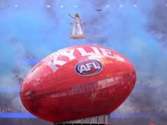 ‘So lucky’: Kylie lights up rain-soaked AFL grand final