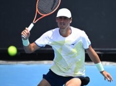 Tomic tumbles out as Italian proves his master in China