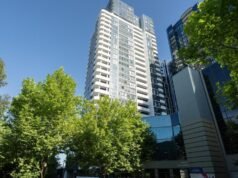 Woman and child found dead outside high-rise apartment