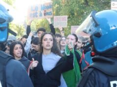 Soldiers guard centre of Milan as thousands march