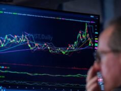 Nasdaq ends down as chipmakers fall
