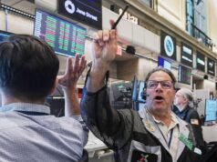Wall Street dips as crude oil prices jump