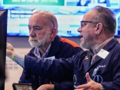 Wall Street closes higher as Fed holds key rate steady