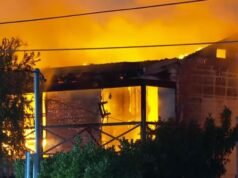 Manhunt after elderly woman rescued from inferno