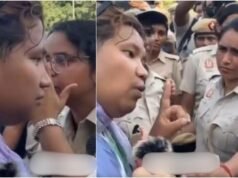 A whisper before detention: Woman cop’s handling of transgender protester wins praise